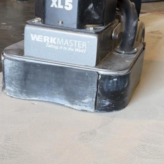 Truck tires and grime on a durable industrial epoxy floor, no damage visible.