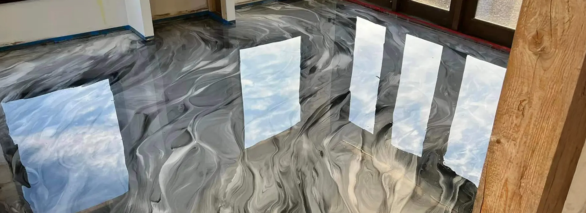 Stylish marble-look epoxy floor in a modern living room, affordable and elegant.